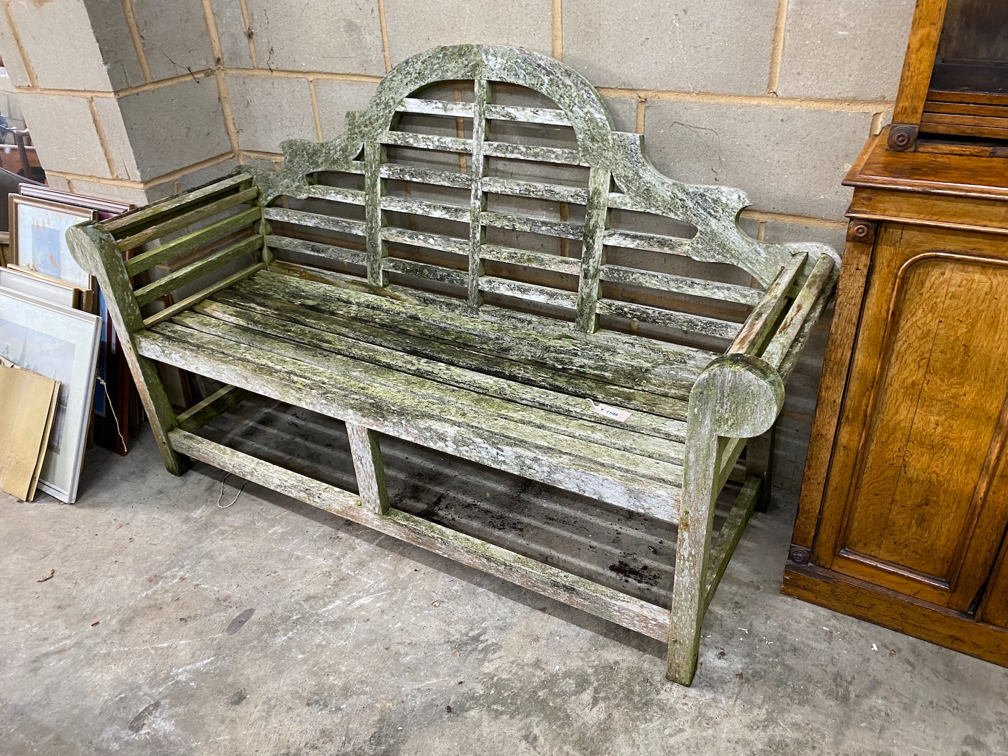 A Lutyens style weathered teak garden bench, length 165cm, depth 64cm, height 101cm